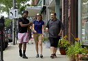 Three students walk down street in Brattleboro